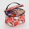 pink puffy baggu lunch box with hello kitty face, apple, and strawberry print with food inside