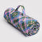 pink, green, and blue plaid puffy picnic blanket with pale yellow star print