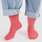 model wearing watermelon pink ribbed socks