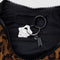 black interior key leash of dark brown leather small crescent bag with black strap