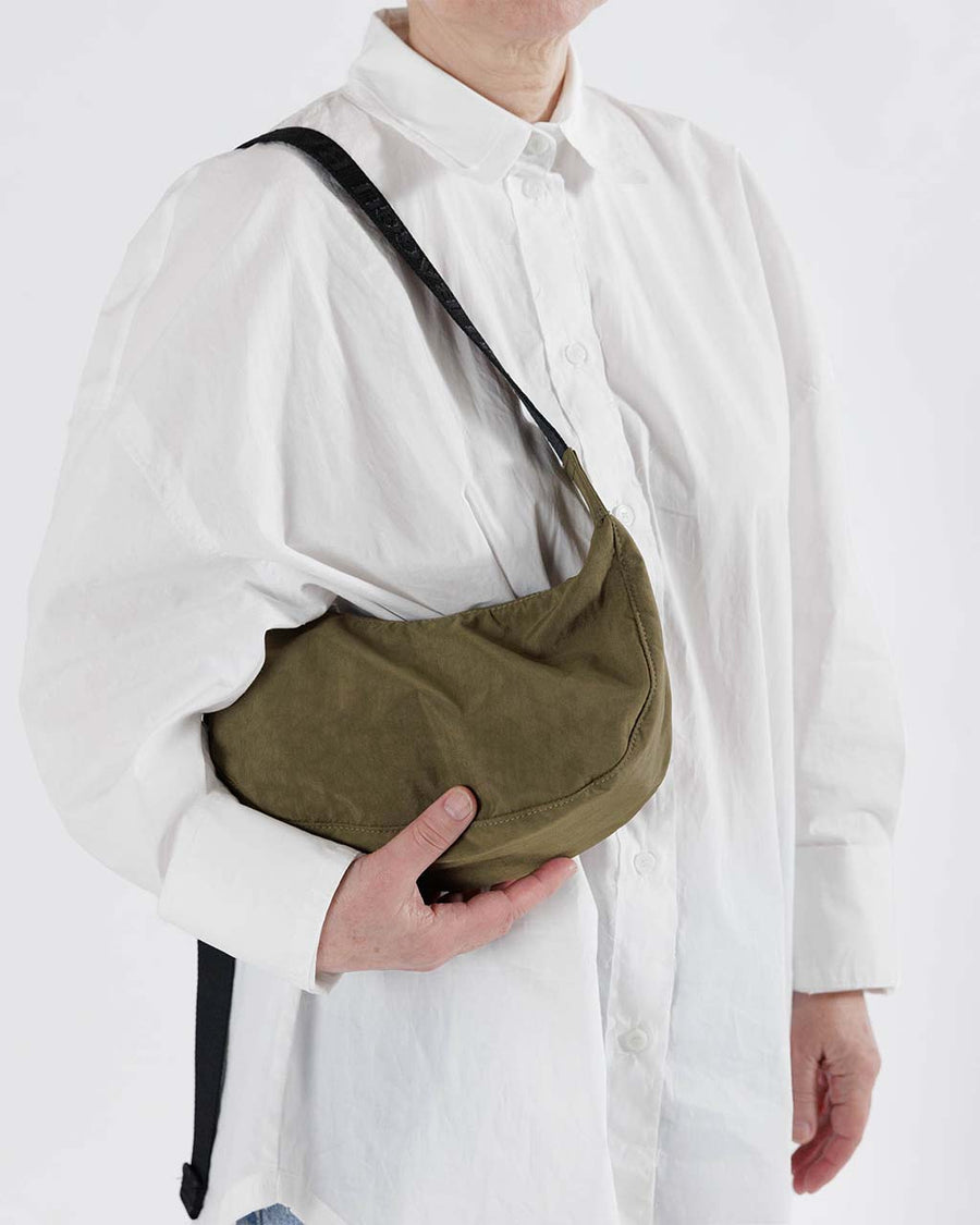 model wearing seaweed small nylon crescent bag