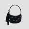 black small nylon crescent bag with silver holographic stars