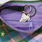 interior key leash on pink, green and blue plaid small crescent bag with black adjustable strap