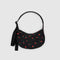 black small crescent bag with matching adjustable strap and red painted wildflower print