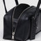 side view of black small dome recycled leather bowler bag with silver charm clasp