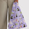model holding lilac standard baggu with all over fancy cat print