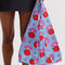 model holding light blue standard baggu with my melody and strawberry print