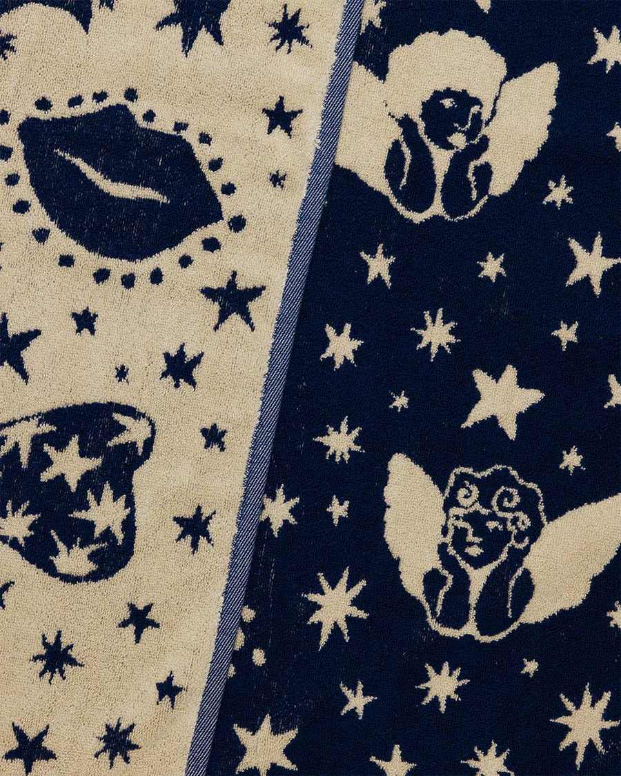 both sides of cream and navy cherub bow print towel