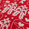 up close of double sided towel with cream and red cowgirl cut-out print