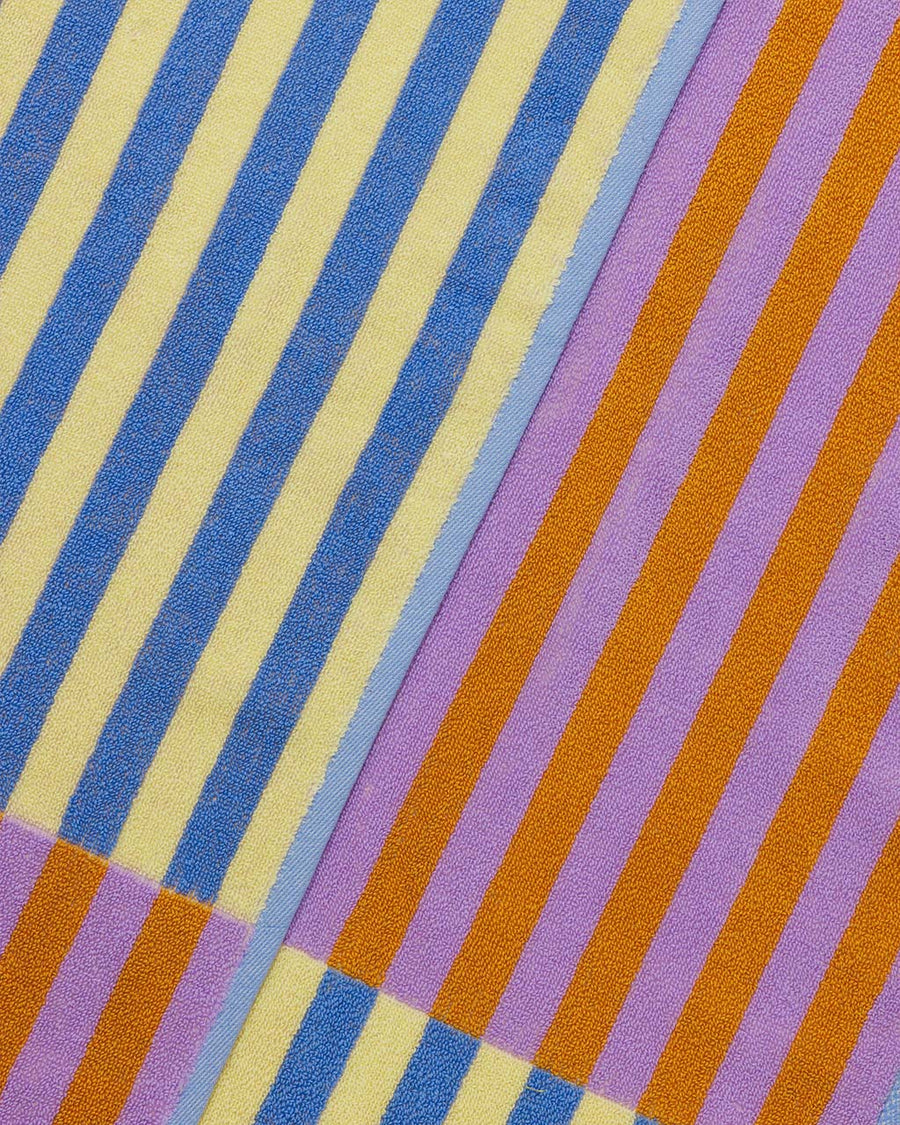 up close of blue/yellow and pink/orange stripe towel