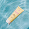 bask spf 30 TSA-approved  lotion: sheer moisturizing sunscreen floating in a pool