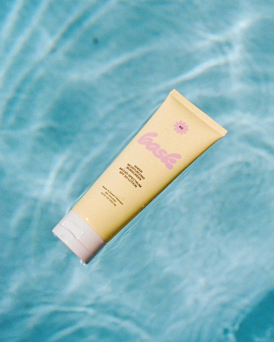 bask spf 30 TSA-approved  lotion: sheer moisturizing sunscreen floating in a pool
