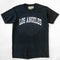 black upcycled tee with white LOS ANGELES across the front
