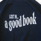 front view of navy sweatshirt with white 'LOST IN... GOOD BOOK' across the front