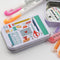 tin with sticker flakes with stationary theme