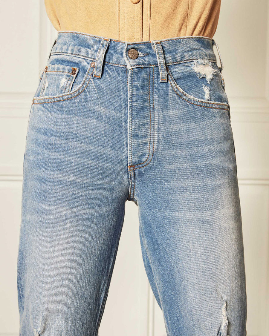 up close of front of light denim jeans