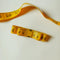 yellow measuring tape bow hair clip