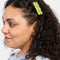 model wearing set of 2 green squiggle hair clips