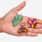 model holding set of three colorful moth hair clips