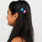 model with blue and purple micro clips in their hair