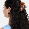 model wearing leopard print and pink orchid with charm hair claw