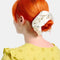 model wearing white silky large scrunchie with all over ant print in their hair