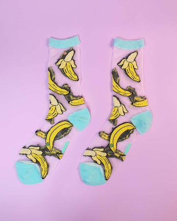 pair of sheer socks with banana print and aqua trim