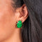 model wearing green and gold beetle stud earrings