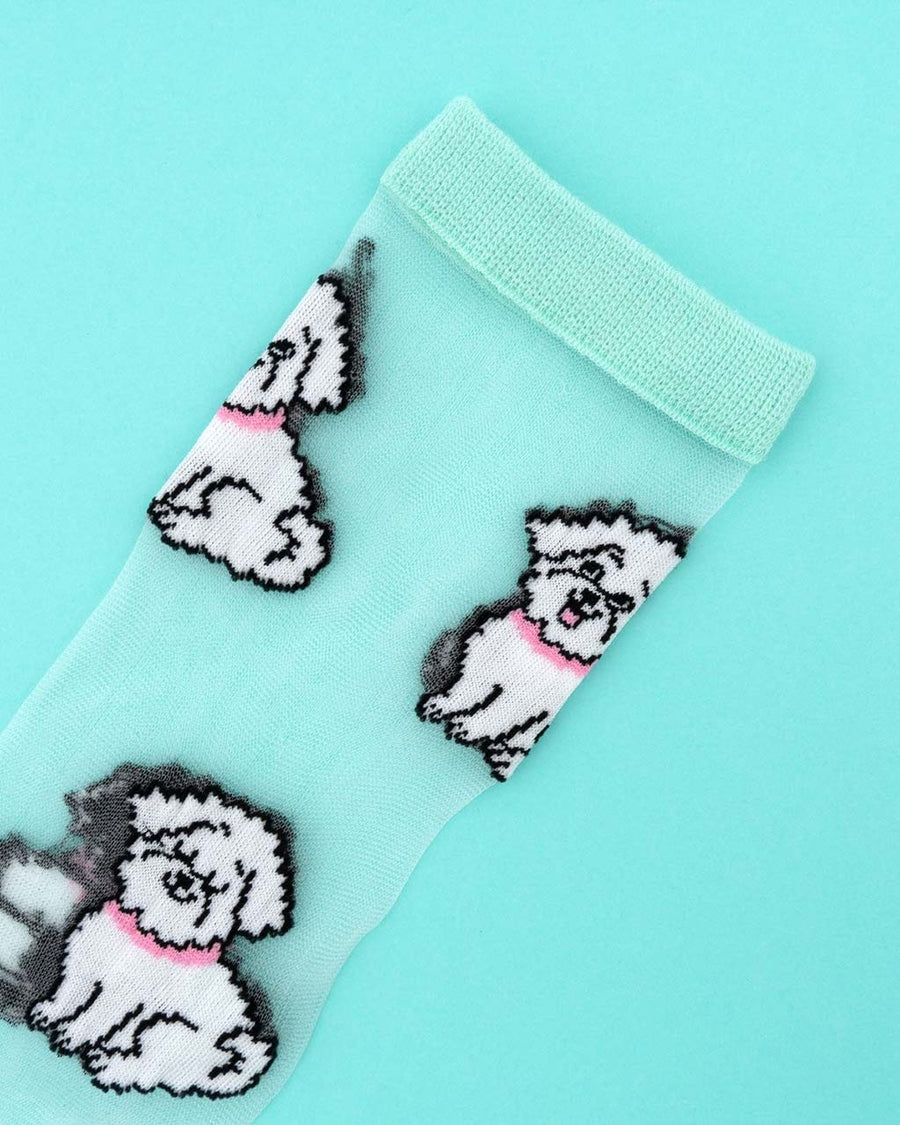 up close of sheer socks with bichon dog print and mint trim