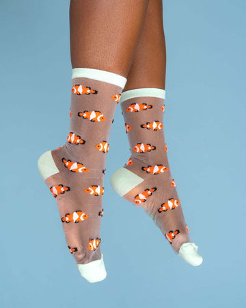 model wearing sheer socks with clownfish print and white trim