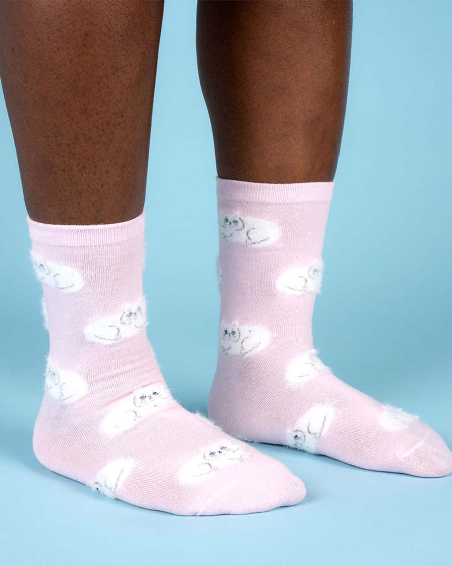 model wearing pink socks with all over white persian cat print