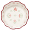 interior of burgundy medium bowl with scalloped top and pretty dainty floral print on the inside