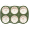 top view of stoneware muffin pan with sage trim and dainty red and sage print