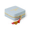 side view of light blue jewelry case with multicolor tassel and gold 'treasure me' across the front