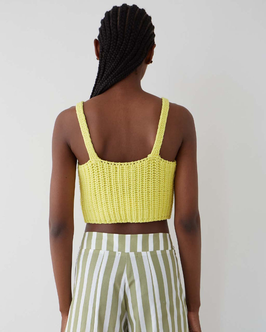 back view of model wearing yellow knit cropped tank