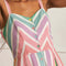 up close of model wearing colorful vertical striped midi sundress with side patch pockets and colorful button front