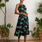 model wearing black tank midi dress with colorful summer fruit print
