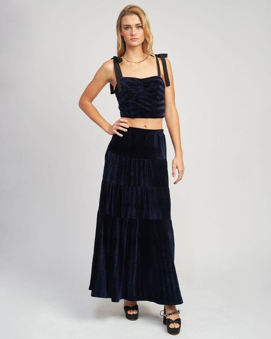 model wearing navy velour midi tiered skirt  and matching tank
