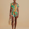 model wearing colorful banana print shorts with matching top