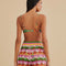 back view of model wearing colorful crochet shorts with crochet tie and scalloped hem