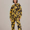 model wearing black long sleeve jumpsuit with abstract banana print