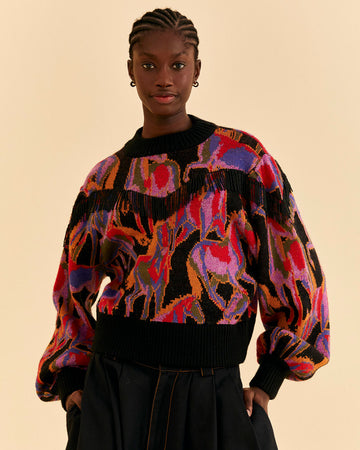 model wearing colorful wild horse sweater with beaded fringe detail