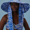 model wearing blue and white tile wide brim bucket hat with long tie straps