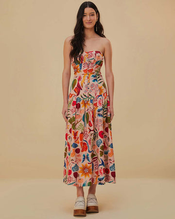 model wearing cream strapless maxi dress with abstract floral print and gorgeous button front detail