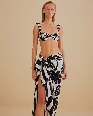 model wearing black and white swim sarong with palm tree print