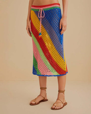 waist down of model wearing open crochet midi skirt with diagonal multicolor stripes and pink drawstring 