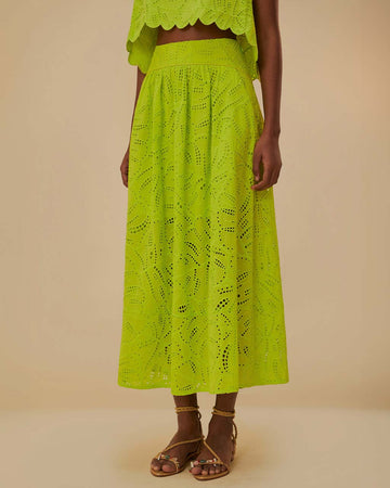 model wearing lime green eyelet maxi skirt with pockets