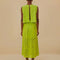 back view of model wearing lime green eyelet maxi skirt with pockets