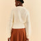 back view of model wearing off white cropped bubble sleeve cardigan