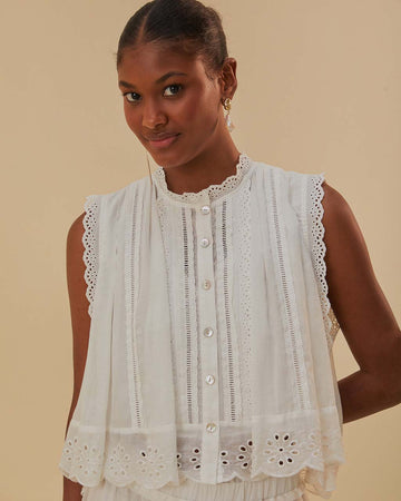model wearing white cotton tank with eyelet and lace detail